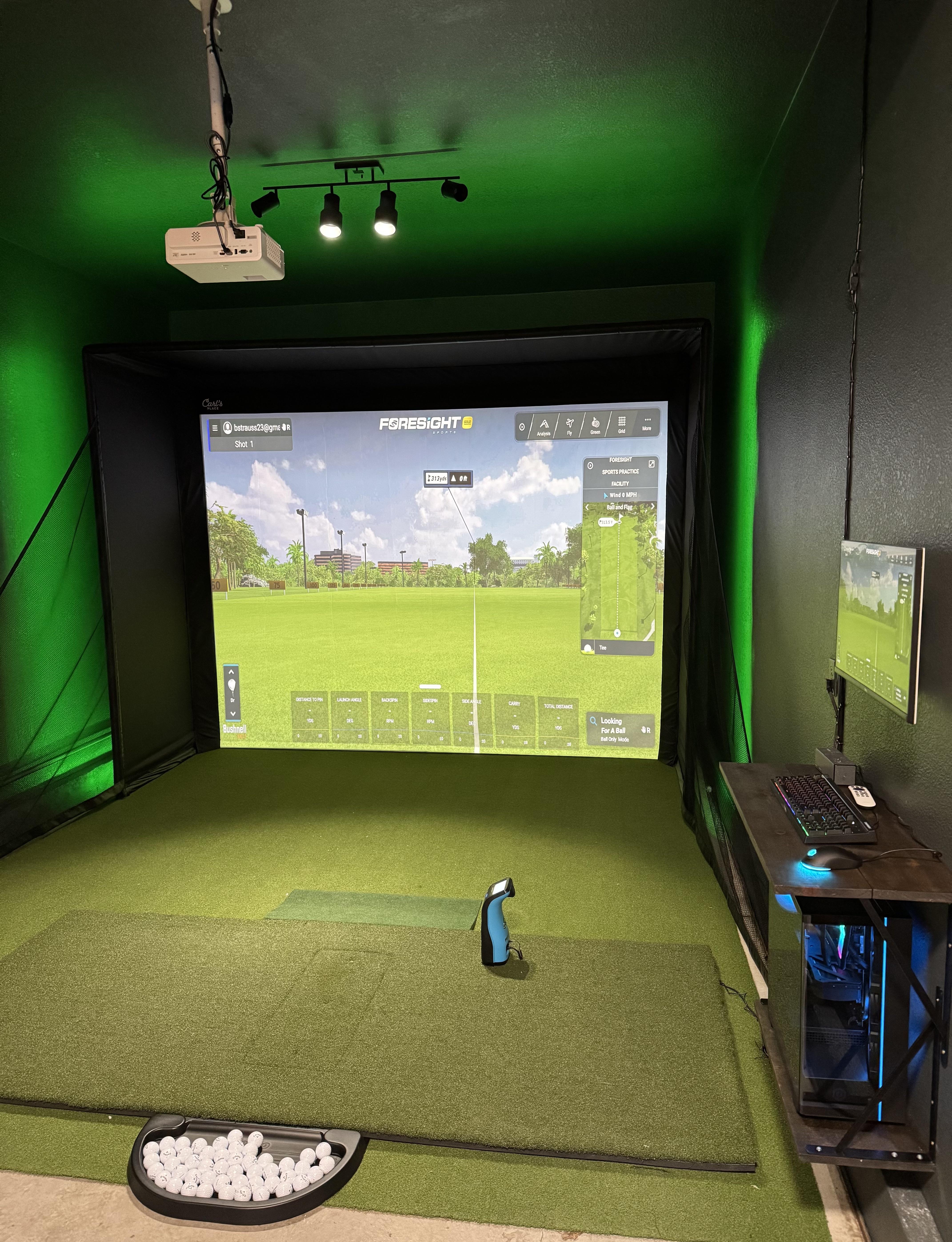 Indoor golf simulator room setup